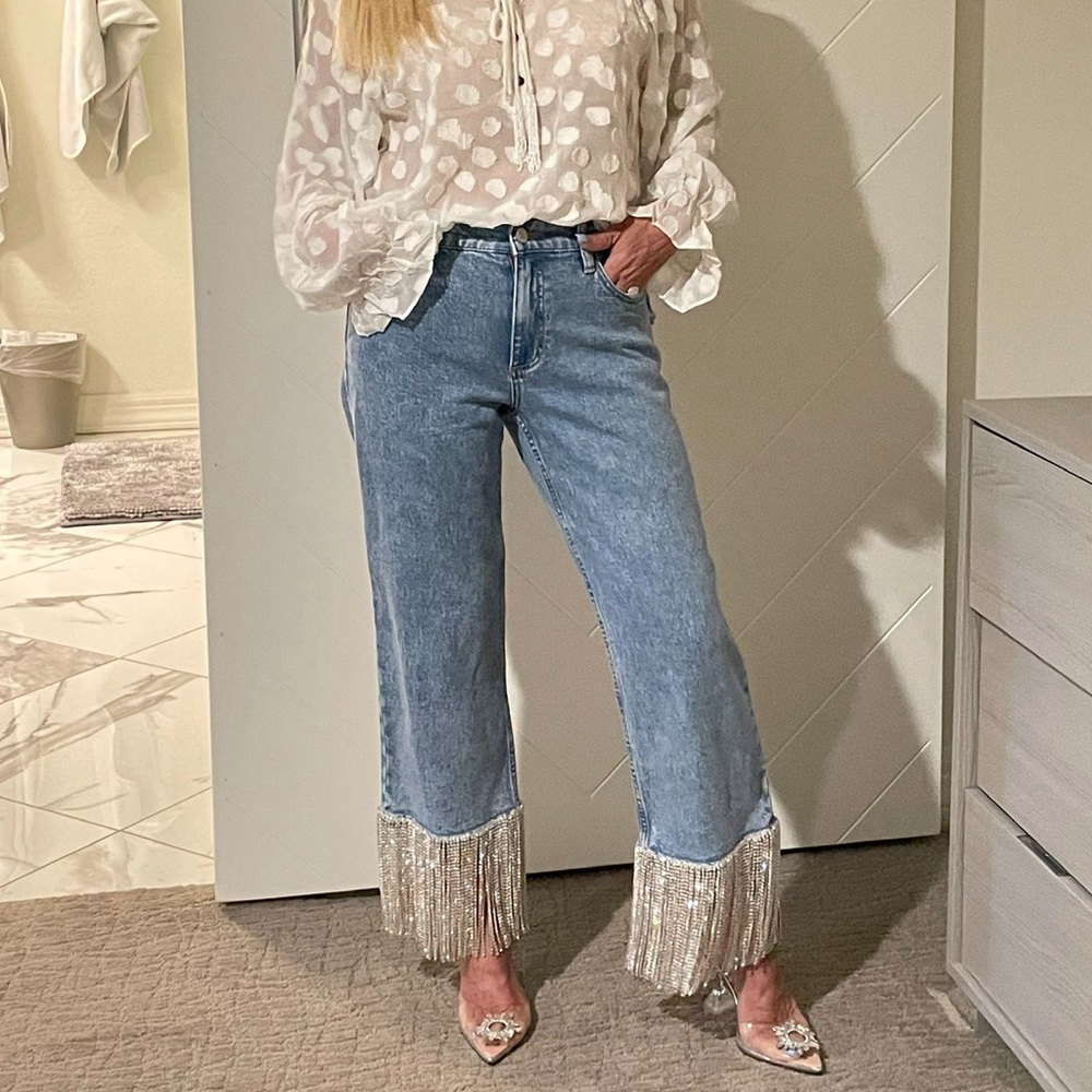 Size 28, BRAND NEW, never worn, not tight fit, regular fit. Paid close to $700.